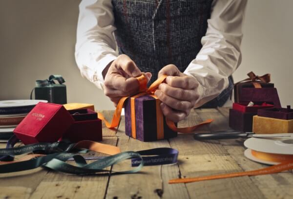 Man packing a gift