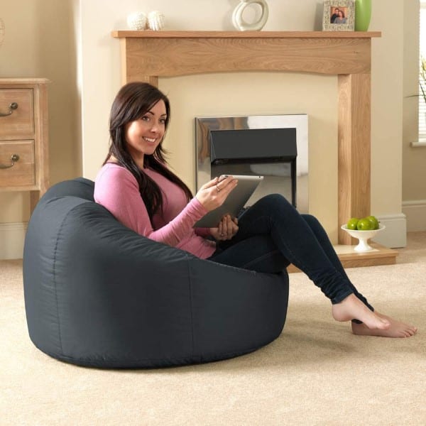 Girl in pink blouse sits on Bazaar Panelled Classic Bean Bag Chair