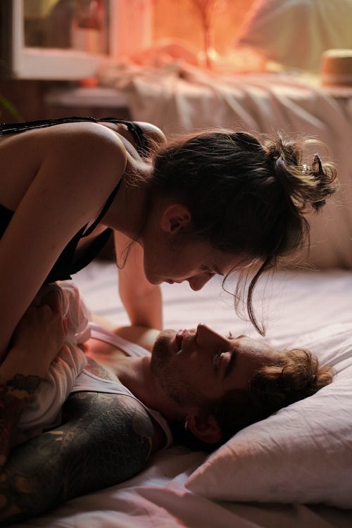 Woman and man in a bed