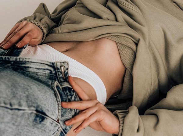Woman taking off her clothes